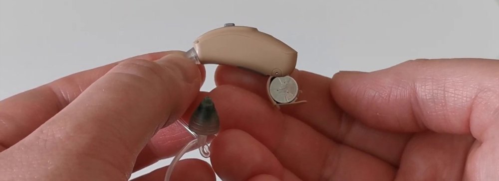 Hearing aid battery chargers